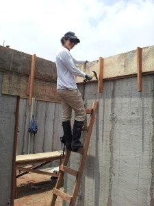 Construction volunteer on ladder