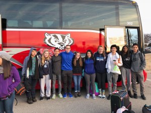 students in front of bus