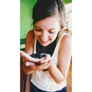 volunteer with baby turtle