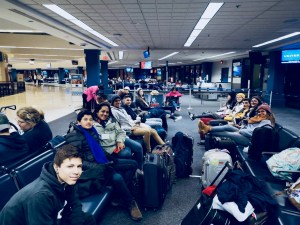 students sleeping at airport